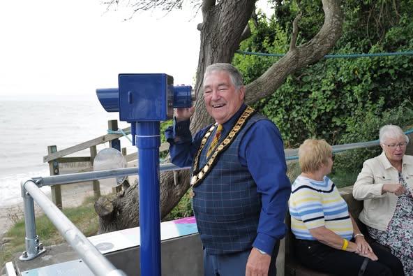 Mayor using telescope
