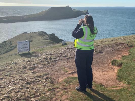 NCI Worms Head watchkeeper on safety patrol by the causeway