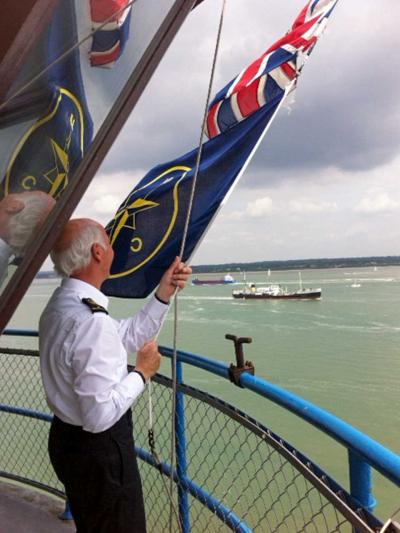 Peter Cookson dips the flags for SS Shieldhall
