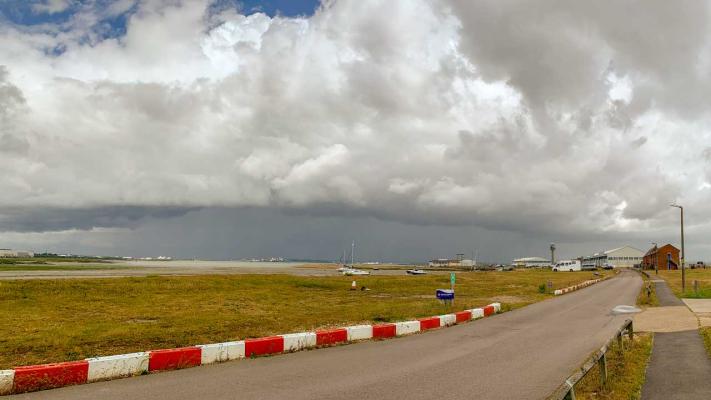 Calshot approach road with roll cloud due to rain squall