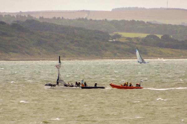 Dismasted yacht with Hamble and Cowes Lifeboats in attendance