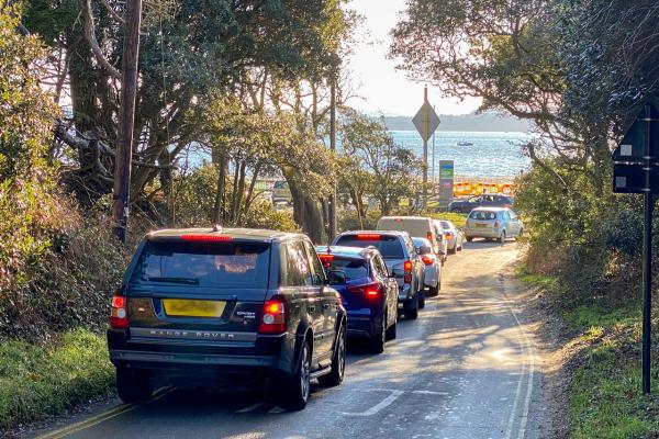 Cars queueing to enter a packed Lepe Country Park