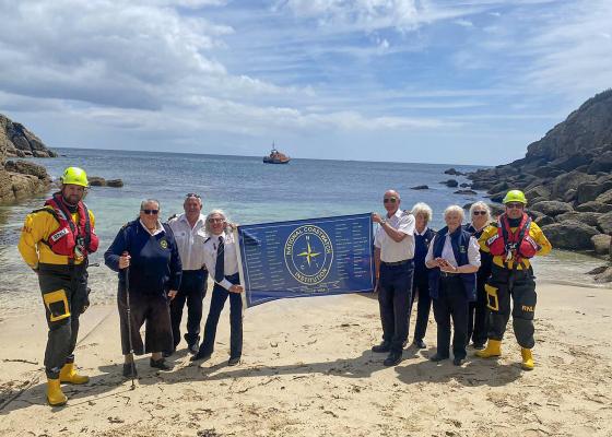National Coastwatch 30th Anniversary Flag arrives at NCI Gwennap Head, Porthgwarra Cove, carried on the RNLI Sennen Cove AWLB City of London III