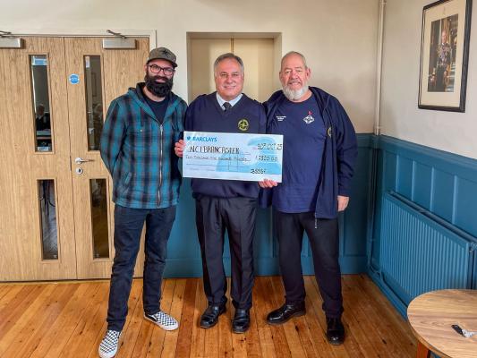 Presentation of cheque by organisers of Brancaster Staithe Sea Shanty Festival