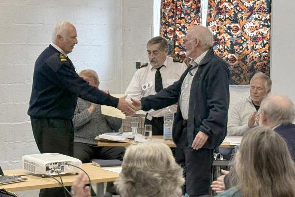 Watchkeeper Andrew W. receives his 15 year service Certificate from Sector Manager Ron H.
