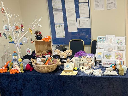 Merchandise stand at Brancaster Staithe Sea Shanty Festival