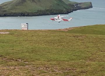 Rescue 187 flying past NCI Worms Head towards Kitchen Corner 